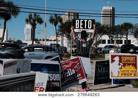 Houston, Texas - November 2, 2018: A Volunteer Holding Beto For Senate Sign Outside Voting Station I