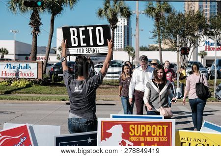 Houston, Texas - November 2, 2018: A Volunteer Holding Beto For Senate Sign Outside Voting Station I