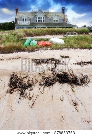 Nantucket Island, Massachusetts, Usa -  October 5: Beach House At The End Of Summer With Boats Turne