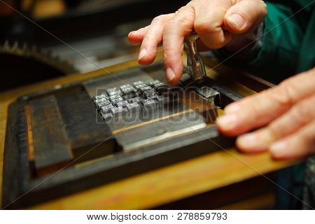 Printer Secures A Metal Type Block In A Wood Chase