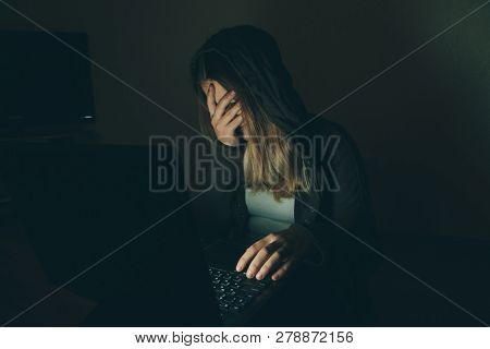 Teenager Girl Suffering Internet Cyber Bullying Scared And Depressed Cyberbullying. Image Of Despair