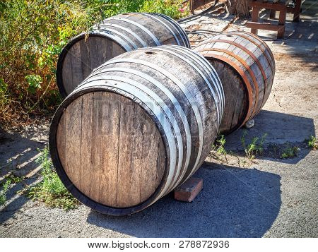 Old Wooden Vinery Barells On The Ground