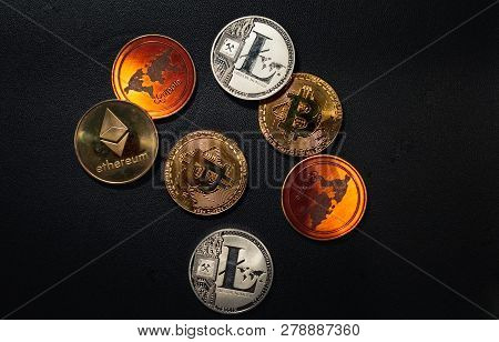 Family Of Cryptocurrency. Stack Of Shining Golden And Silver Coins On Dark Black Background. Crypto 