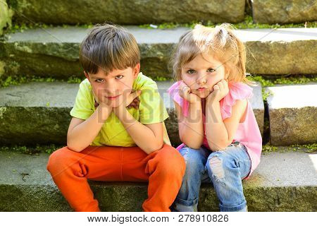 Small Girl And Boy On Stairs. Relations. Summer Vacation. Childhood First Love. Couple Of Little Chi