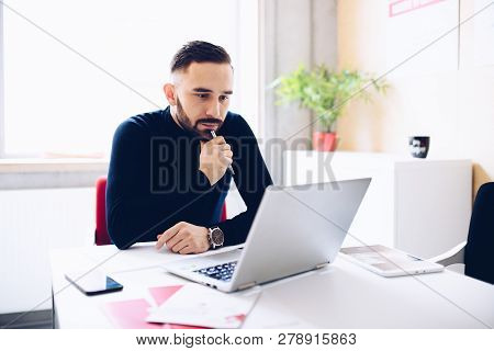 Caucasian Thoughtful Businessman In His Office.