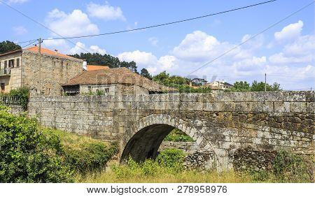 View Of The Medieval Bridge In Granite Masonry Of Village Of Matanca, Fornos De Algodres, Portugal