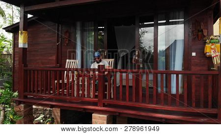 Bali, Indonesia - December 27, 2018: Young Couple Relaxing At Luxury Villa On Bali Island. 4k Flying