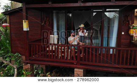 Bali, Indonesia - December 27, 2018: Young Couple Relaxing At Luxury Villa On Bali Island. 4k Flying