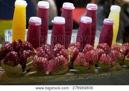Close Up Picture Of Typical Orange And Pomegranate Juices Usually Sold In The Street Stalls Of Bangk