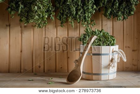 A Wooden Bucket And A Birch Broom In A Russian Bath. Sauna.