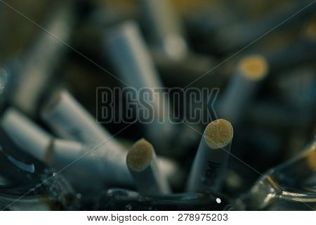 Macro Photo Of The Cigarette Butts Background. Royalty High-quality Stock Closeup Photo Image Of Dir