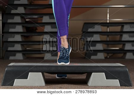 Step Platform. Foot On Step Platform. Classes In The Gym. Fitness Aerobics.