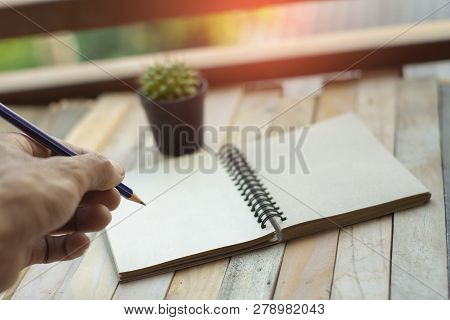 Notepad With Pencil On Wood Board Background.using Wallpaper For Education, Business Photo.take Note