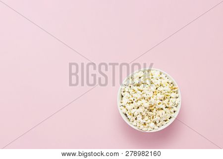 Bowl With Popcorn On A Pink Background. Flat Lay, Top View.