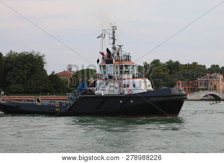 Big Powerful Tugboat On The Water Of The Sea