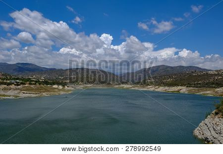 Scenic Landscape Shot Of Germasogeia Dam In Cyprus On A Beautiful Blue Sky Day.  Wind Patterns On Th