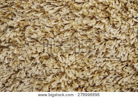 Close Up Of Beige Domestic Carpet Texture.