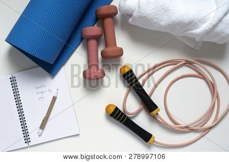 Jump Rope, Yoga Mat, Dumbbells, White Bath Towel, Notepad, Close-up On A White Background