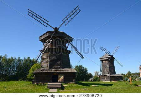 Suzdal, Russia - August 20, 2015: Two Old Wooden Windmills In The Museum Of Wooden Architecture On A