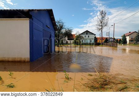 Building In A Flooded Area After Heavy Rainfalls, Muddy Water