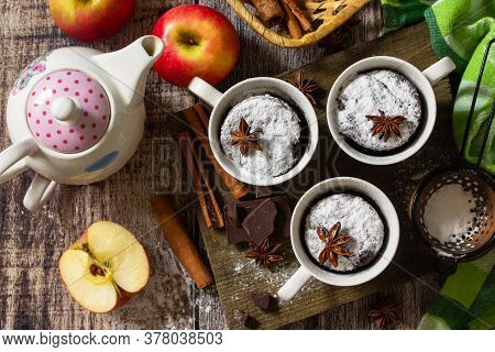Quick Autumn Dessert. Autumn Apple Pie Mugcake With Red Apples And Spices On A Rustic Background. To