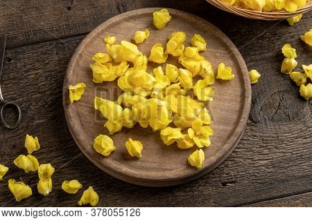 Fresh Denseflower Mullein Flowers On A Cutting Board, Top View