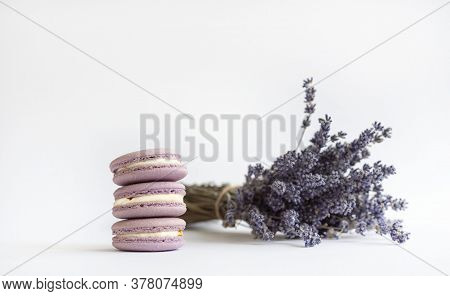 Lilac Macarons With Lavender Bouquet On White Isolated Background