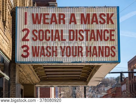 Mockup Of Movie Cinema Billboard With Wear A Mask, Social Distance And Wash Hands To Deal With The C