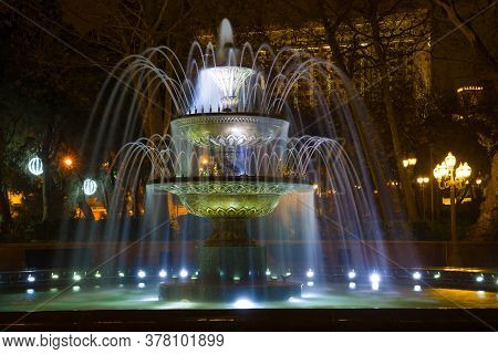 Old Fountain In The Former Governor Park (wahid Park) Close-up On A Winter Night. Baku, Azerbaijan