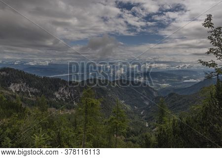 View On Drau River Valley From Path To Mittagskogel Hill In Cloudy Summer Day