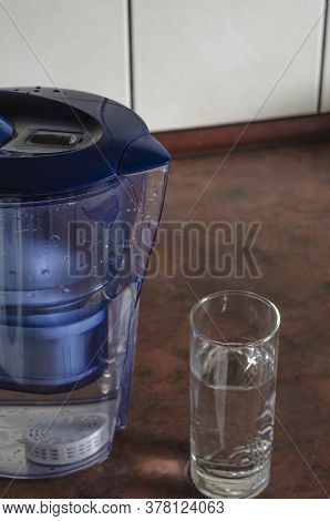 Water Filter Jug With Silicon Cartridge Inside On The Kitchen Counter.