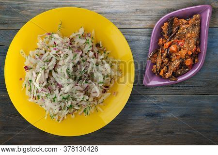 Salad Daikon, Onions And Dill On Blue Grey Wooden Background. Salad On Yellow Plate With Vegetarian 