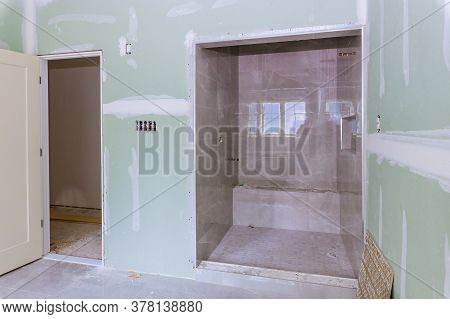 Bathroom With Renovation Home Remodeling In Shower With Beige Tiles For Repair In The Bathroom
