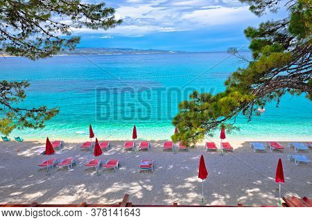 Idyllic Pine Trees And Pebble Beach In Baska Voda View, Makarska Riviera In Dalmatia, Croatia