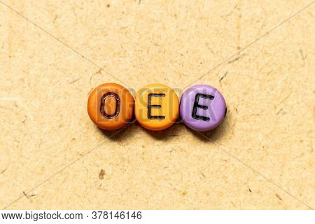 Round Color Bead With Black Letter In Word Oee (abbreviation Of Overall Equipment Effectiveness) On 