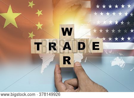 Hand Putting Wooden Cube Block For Trade War On China Flag And Us Flag.it Is Symbol Of Economic Tari