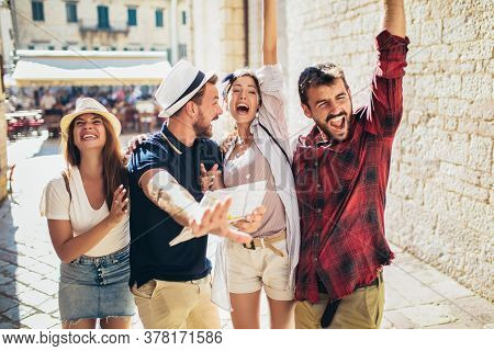 Appy Group Of Tourists Traveling And Sightseeing