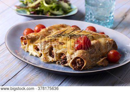Six Italian Canneloni Pasta Rolls On Wood