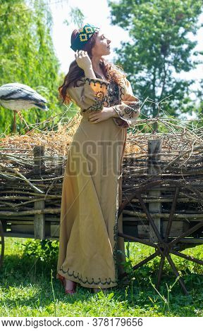 Armenian Young Woman In Traditional Clothes In The Forest