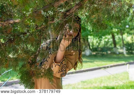 Armenian Young Woman In Traditional Clothes In The Forest