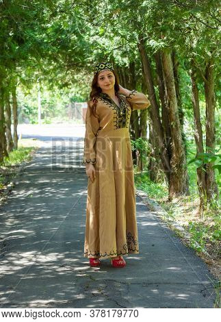 Armenian Young Woman In Traditional Clothes In The Forest