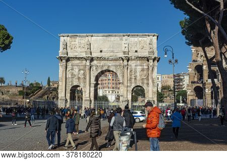Rome, Italy, 25.12.2019: Arch Of Costantine In Rome In Cloudy Day With Tourist
