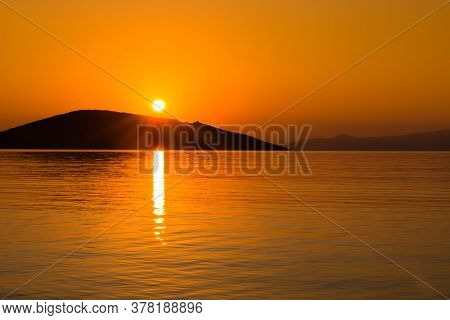 Awesome Sescape Sunrise Above Calm Water With Island