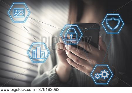 Information Security. Young Woman Using Smartphone Indoors, Closeup