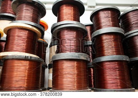 Many Coils Of Copper Wire In The Production Workshop, Winding Copper Cable On Spools