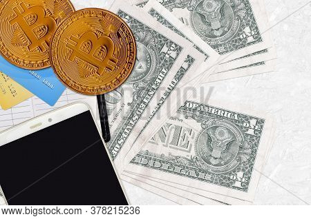 1 Us Dollar Bills And Golden Bitcoins With Smartphone And Credit Cards. Cryptocurrency Investment Co