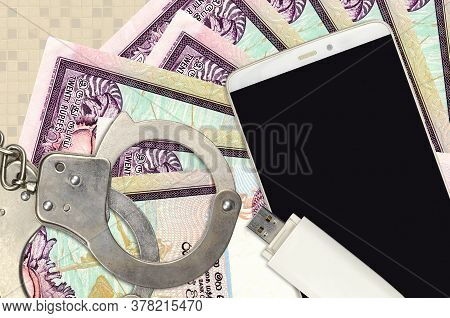 20 Sri Lankan Rupees Bills And Smartphone With Police Handcuffs. Concept Of Hackers Phishing Attacks