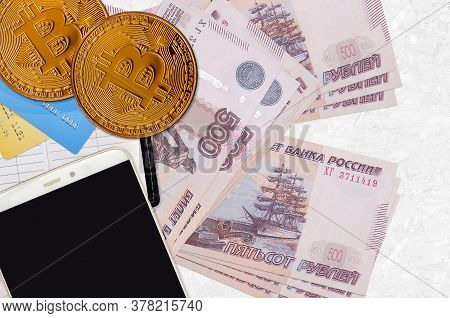 500 Russian Rubles Bills And Golden Bitcoins With Smartphone And Credit Cards. Cryptocurrency Invest