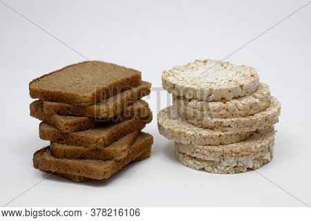 Wholemeal Rye Bread And Rice Waffles On A White Background