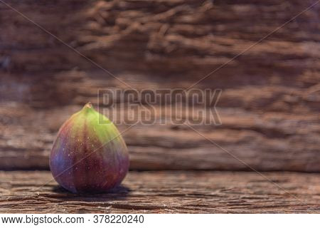 Fresh Fig Fruits On Aged Wooden Background